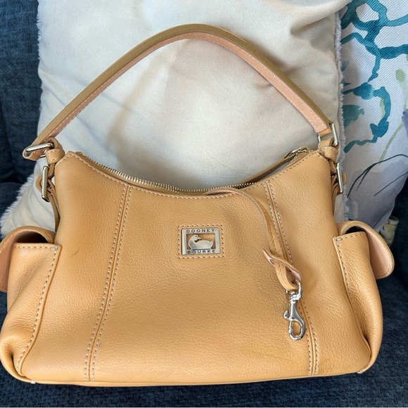 Dooney and Bourke Bag . Medium sized. Has imperfections . - Picture 9 of 17